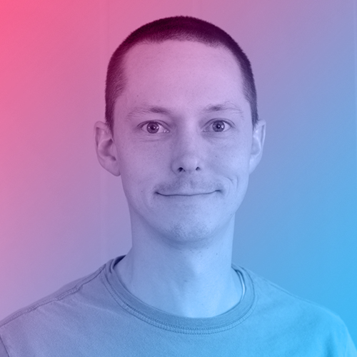 Portrait of Jacob. He's sporting a trimmed haircut and a wide smile.